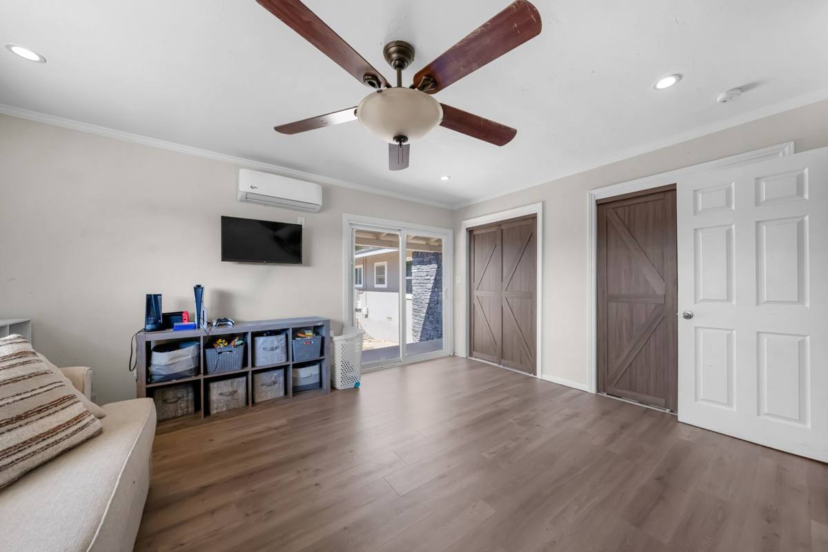 Bedroom with barn-style closet doors