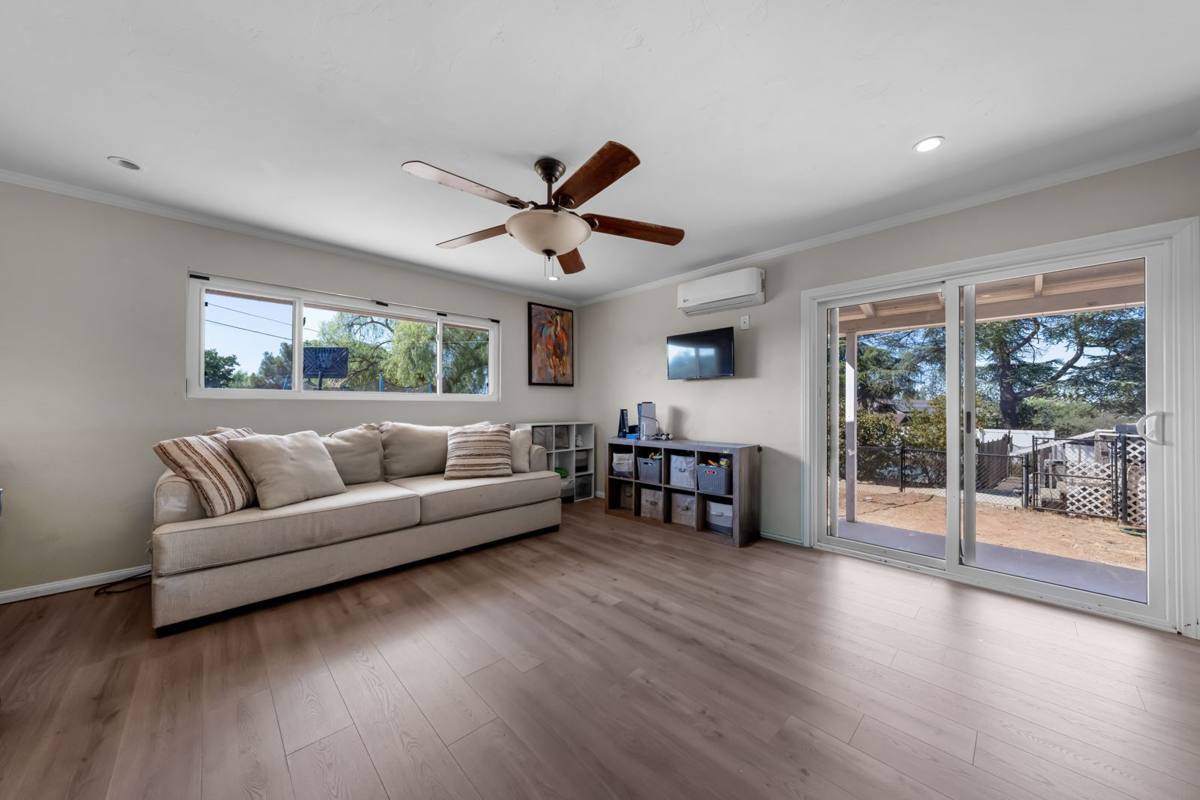 Bedroom with sliding glass door to the covered patio