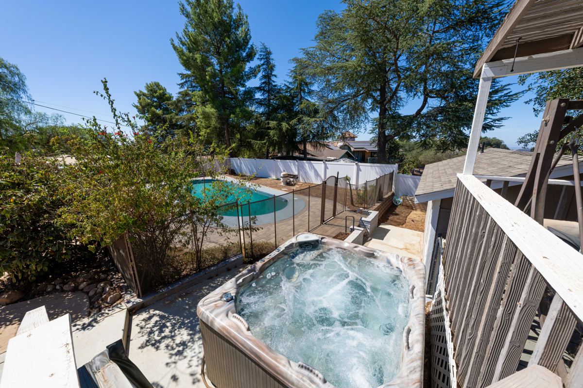 Original, unaltered daytime photo of the spa and pool
