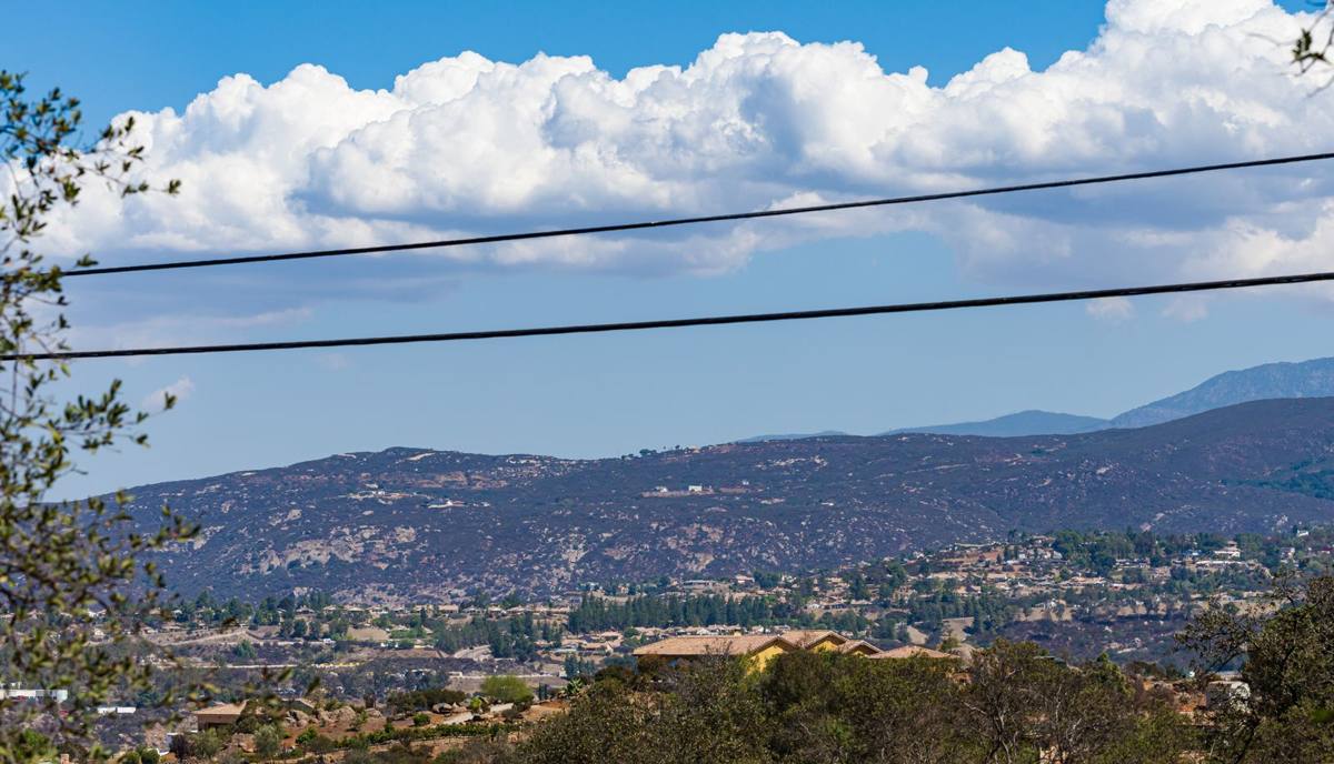 Sweeping valley and mountain view under big clouds